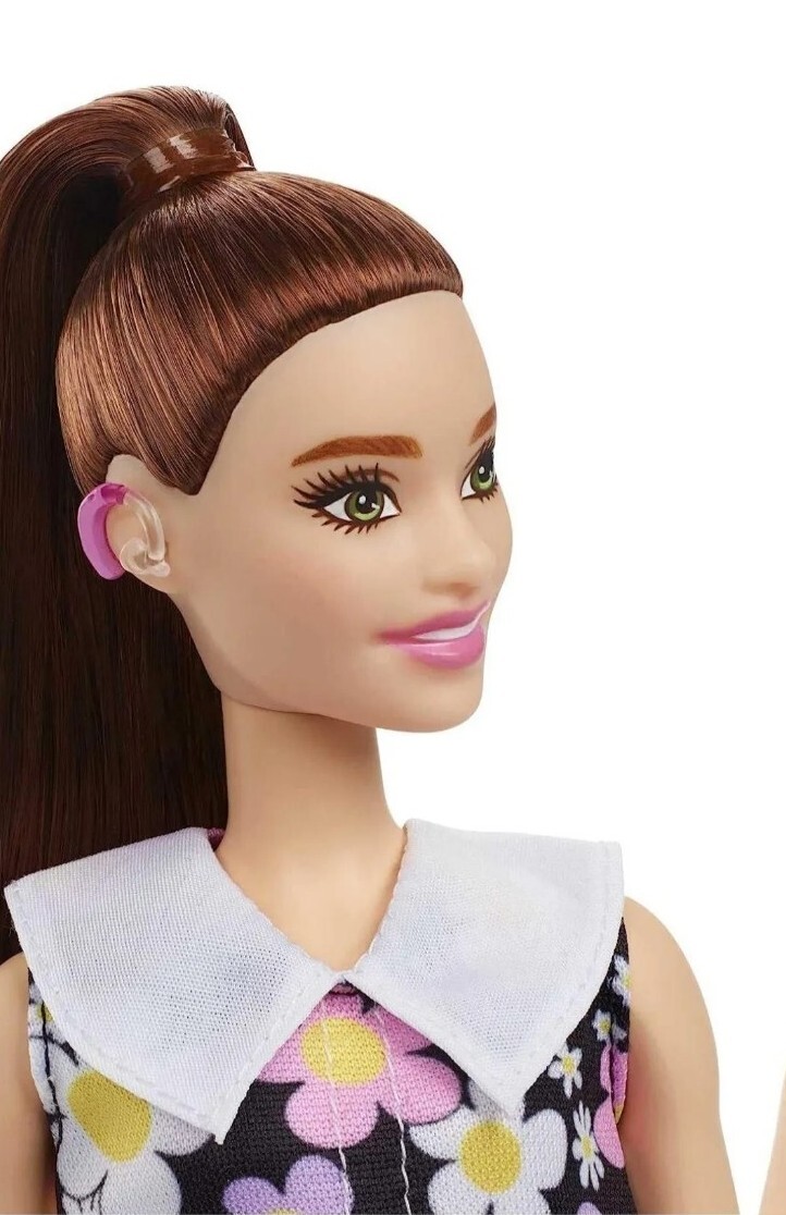 Barbie Fashionistas Doll #187 wearing pink behind-the-ear hearing aids